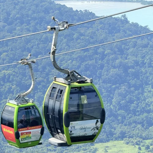 Tourists riding the Langkawi Cable Car over tropical rainforest canopy, an iconic part of a Junglewalla Malaysia Tour